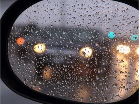 Rain on a car mirror.