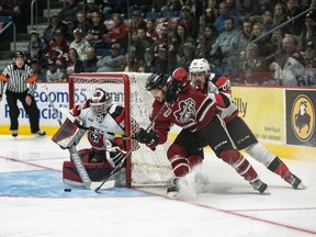 67's netminder Cédrick Andrée foils a scoring attempt by Domenic Commisso of the Storm during the 2019 OHL final.