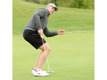 Brady Tkachuk tries to will his putt in with his body on the 12th green.  Ottawa Senators players and staff took to the Marshes Golf Club Tuesday for the Annual Bell Senators Charity Golf Classic, where foursomes are rounded out with players to raise money for the Sens Foundation.
