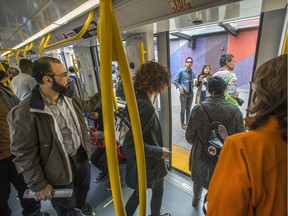 Passengers get off the train at Tunney's Pasture while others wait to get on as the LRT is seen in operation on day 2 of the system up and running.