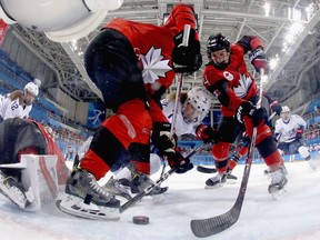 Renata Fast #14 of Canada goes to the net against Monique Lamoureux-Morando #7 of the United States during the Women's Ice Hockey Preliminary Round Group A game on day six of the PyeongChang 2018 Winter Olympic Games at Kwandong Hockey Centre on February 15, 2018 in Gangneung, South Korea.