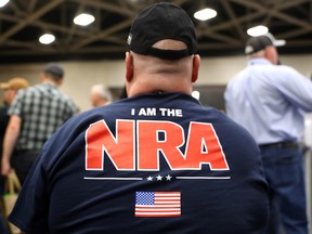 An attendee wears an NRA shirt during the NRA Annual Meeting & Exhibits at the Kay Bailey Hutchison Convention Center on May 5, 2018 in Dallas, Texas. (Justin Sullivan/Getty Images)