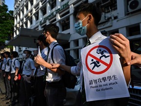 In this picture taken on Sept. 9, 2019, students take part in a joint school human chain rally in Hong Kong. (ANTHONY WALLACE/AFP/Getty Images)