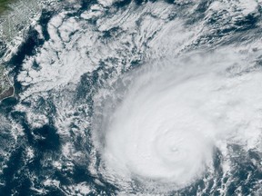 This satellite image obtained from NOAA/RAMMB, shows Tropical Storm Humberto at 15:10 UTC on WEDNESDAY as it moves off the US east coast in the Atlantic Ocean.