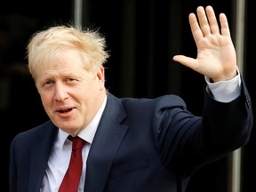 Britain's Prime Minister Boris Johnson leaves the hotel on the second day of the Conservative Party annual conference in Manchester, Britain, Sept. 30, 2019.