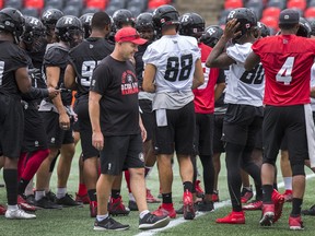 Over the next two weeks Redblacks coach Rick Campbell and longtime pal, Lions coach DeVone Claybrooks, play back-to-back games against each other. 
(Wayne Cuddington/Ottawa Sun)