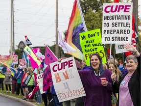 Education workers protest in front of the Ottawa Catholic School Board on Tuesday.