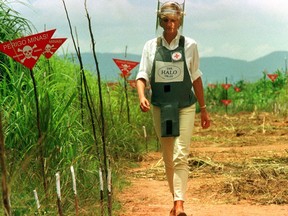 Diana, Princess of Wales, is seen in this Jan. 15 1997 file picture walking in one of the safety corridors of the land mine fields of Huambo, Angola, during her visit to help a Red Cross campaign to outlaw landmines worldwide. (Reuters)