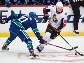 Ottawa Senators' Logan Brown, right, skates with the puck while being checked by Vancouver Canucks' Loui Eriksson during second period NHL pre-season hockey action in Abbotsford, B.C., on Monday, Sept. 23, 2019.