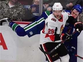 Sep 25, 2019; Vancouver, British Columbia, CAN; Ottawa Senators forward Connor Brown (29) checks Vancouver Canucks forward Nikolay Goldobin (77) during the third period at Rogers Arena.