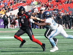 William Arndt #8 of the Ottawa Redblacks attempts to avoid getting sacked by Robbie Smith #39 of the Toronto Argonauts in the fourth quarter during a CFL game held at TD Place, on September 07, 2019.
