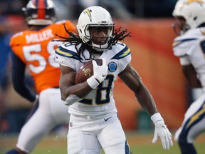 In this Dec. 30, 2018, file photo, Los Angeles Chargers running back Melvin Gordon rushes during the second half of the team's NFL football game against the Denver Broncos in Denver.