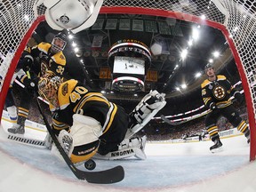 Boston Bruins defenceman Zdeno Chara sweeps the puck out of the crease after it got behind goaltender Tuukka Rask during the second period in game seven of the 2019 Stanley Cup Final against the St. Louis Blues at TD Garden on June 12, 2019.