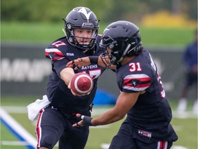 Carleton Ravens quarterback Tanner DeJong hands the ball off to Nathan Carter during a home victory over the Toronto Varsity Blues on Saturday, Sept. 28, 2019. Valerie Wutti photo