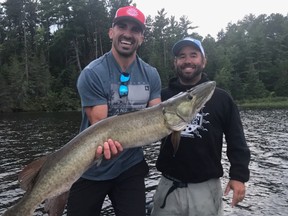 Three weeks ago, Ottawa Redblacks receiver Brad Sinopoli (left) hauled in a 48-inch musky while out on the Ottawa River 
with fishing guide Jamie Pistilli. Sinopoli was using a specially made spinner complete with a Redblacks logo.