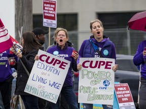 Education workers protest in front of the Ottawa Catholic School Board earlier this week.