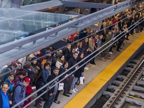 Commuters at the Tunney's Pasture Station await their train on Monday October 7, 2019.