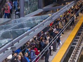 Commuters at the Tunney's Pasture Station await their train on Monday October 7, 2019.