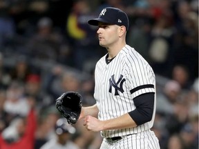 James Paxton of the New York Yankees walks back to the dugout after closing out the top of the second inning against the Houston Astros in Game 5 of the American League Championship Series at Yankee Stadium on Oct. 18, 2019 in New York City.