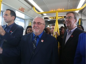 John Manconi, left, Allan Hubley and Jim Watson enjoy the LRT launch on Sept. 14, 2019.