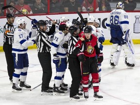 File photo/ Ottawa Senators #7 Brady Tkachuk is led away by a linesman after being in the centre of a battle in front of the Tampa Bay Lightning net during NHL hockey action at Canadian Tire Centre in Ottawa on on April 1, 2019.