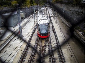 Commuters come and go from Tunney's Pasture Station.