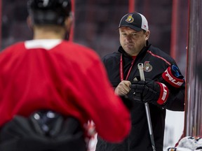Ottawa Senators head coach DJ Smith gives instructions to his players during team practice.