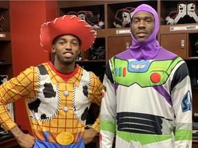 Redblacks receivers R.J. Harris, left, and Dominique Rhymes show off their Toy Story Halloween costumes before Thursday's short practice at TD Place stadium on Thursday.