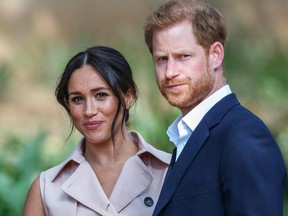 Prince Harry, Duke of Sussex and Meghan, the Duchess of Sussex arrive at the British High Commissioner residency in Johannesburg where they will meet with Graca Machel, widow of former South African president Nelson Mandela, in Johannesburg, on Oct. 2, 2019. (MICHELE SPATARI/AFP via Getty Images)