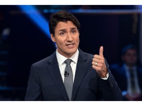 Canada's Prime Minister and Liberal leader Justin Trudeau speaks during the Federal leaders French language debate at the Canadian Museum of History in Gatineau, Quebec on October 10, 2019. (Photo by Adrian Wyld / POOL / AFP)