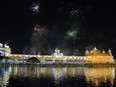 Fireworks explode over the Golden Temple as Indian Sikh celebrate Diwali, in Amritsar on Saturday.