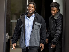 Brothers Federique, left, and Jean-Paul Theragene leave the Ottawa courthouse during a break in proceedings earlier this month.