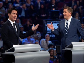 Liberal Leader Justin Trudeau and Conservative Leader Andrew Scheer debate a point during the federal leaders debate in Gatineau on Monday, Oct. 7, 2019.