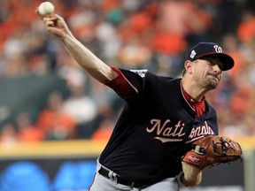 Daniel Hudson of the Washington Nationals delivers the pitch against the Houston Astros during the eighth inning in Game 1 of the 2019 World Series at Minute Maid Park on Oct. 22, 2019 in Houston, Texas. (Mike Ehrmann/Getty Images)
