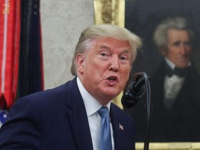 With a portrait of former U.S. President Andrew Jackson hanging in the background, U.S. President Donald Trump speaks as he awards the Presidential Medal of Freedom to former Attorney General Edwin Meese in the Oval Office of the White House in Washington, D.C., on Tuesday, Oct. 8, 2019.
