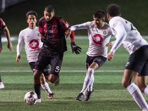 Ottawa Fury FC's Wal Fall looks for somewhere to go against Charleston at TD Place stadium on Wednesday, Oct. 23, 2019.