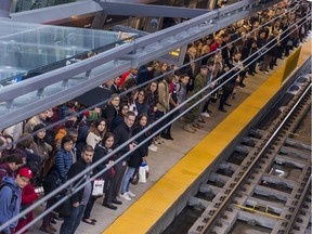Commuters at the Tunney's Pasture Station await their train on Monday October 7, 2019.