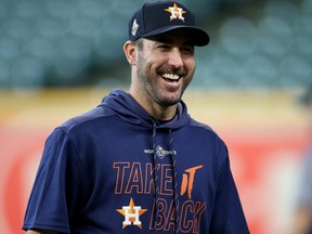 Justin Verlander of the Houston Astros laughs during batting practice prior to Game 1 of the 2019 World Series against the Washington Nationals at Minute Maid Park on Oct. 22, 2019 in Houston. (BOB LEVEY/Getty Images)