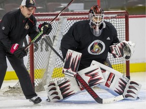 Ottawa Senators goaltender Anders Nilsson works with goaltending coach Pierre Groulx at team practice on Thursday, Oct. 24, 2019. Coach D.J. Smith planned to consult with Groulx before announcing who would be between the pipes on Friday.