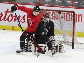 Ottawa Senators Brady Tkachuk and Anders Nilsson during practice at the Canadian Tire Centre in Ottawa on Monday.