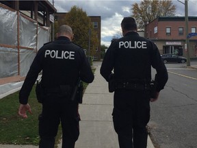 Sgt. Wayne Stangle and Sgt. Andrew Pidcock walk the beat in Vanier as Ottawa police launch their new neighbourhood response teams.