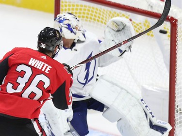 Colin White scores on Curtis McElhinney in the second period as the Ottawa Senators take on the Tampa Bay Lightning in NHL action at the Canadian Tire Centre. Photo by Wayne Cuddington / Postmedia