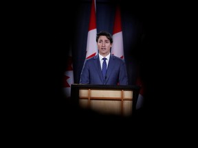 Prime Minister Justin Trudeau speaks to the news media for the first time since winning a minority government in the federal election, at the National Press Theatre in Ottawa, Oct. 23, 2019. (REUTERS/Stephane Mahe)