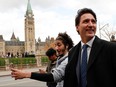 Prime Minister Justin Trudeau walks before speaking to reporters on Oct. 23, 2019 --the first since Monday's election