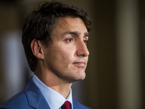 Federal Liberal leader Justin Trudeau, joined by MPs and Liberal candidates, makes an announcement in Toronto on Sept. 20, 2019.
