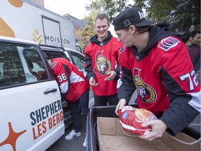 The Ottawa Senators' Colin White, (from left) Brady Tkachuk, and Thomas Chabot,  along with (not shown) Mark Borowiecki and Christian Wolanin, delivered 50 turkeys to The Ottawa Mission to help feed those in need at The Ottawa Mission, the Shepherds of Good Hope (Ottawa), and Moisson Outaouais (Gatineau).