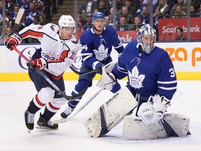 Washington Capitals winger Jakub Vrana (13) looks for a rebound against Maple Leafs goaltender Frederik Andersen as defenceman Tyson Barrie looks on during the first period on Tuesday night at Scotiabank Arena. (Hans Deryk/The Canadian Press)