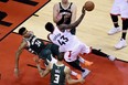 Milwaukee Bucks forward Giannis Antetokounmpo fouls out of the game as Toronto Raptors forward Pascal Siakam drives to the net during the Eastern Conference final earlier this year. (THE CANADIAN PRESS)