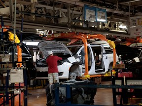 Assembly line workers at the Fiat Chrysler Automobiles (FCA) Windsor Assembly plant is pictured in this Oct. 5, 2018 file photo in Windsor, Ont. (JEFF KOWALSKY / AFP)JEFF KOWALSKY/AFP/Getty Images)