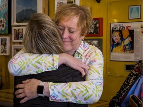 Ola Cocina owner Donna Chervrier gets a hug from one of her many supporters after receiving a fundraising check for $22,000. Her business was recently vandalized and an outpouring of support from the community has allowed he rot reopen the business. November 1, 2019. Errol McGihon/Postmedia